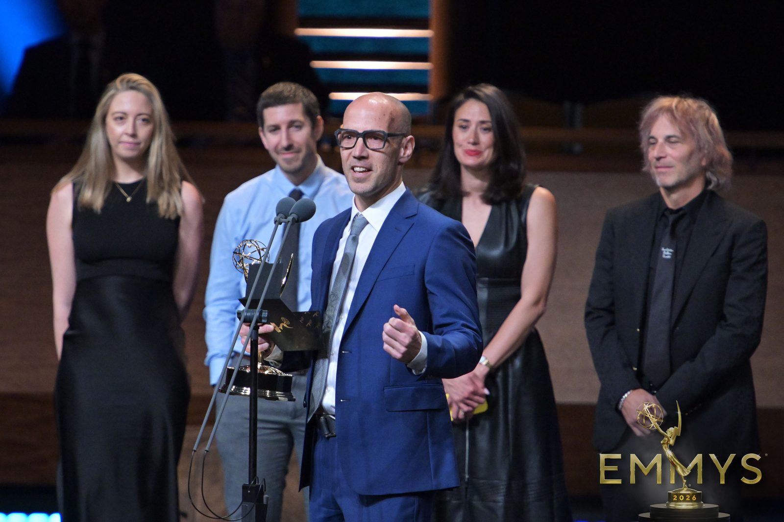 Nathan Ross and the Critical Incident team accept their Emmy on stage at the 2026 News and Documentary Emmys
